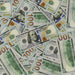 Scattered Full Print New Series $100 prop bills showing Franklin portraits