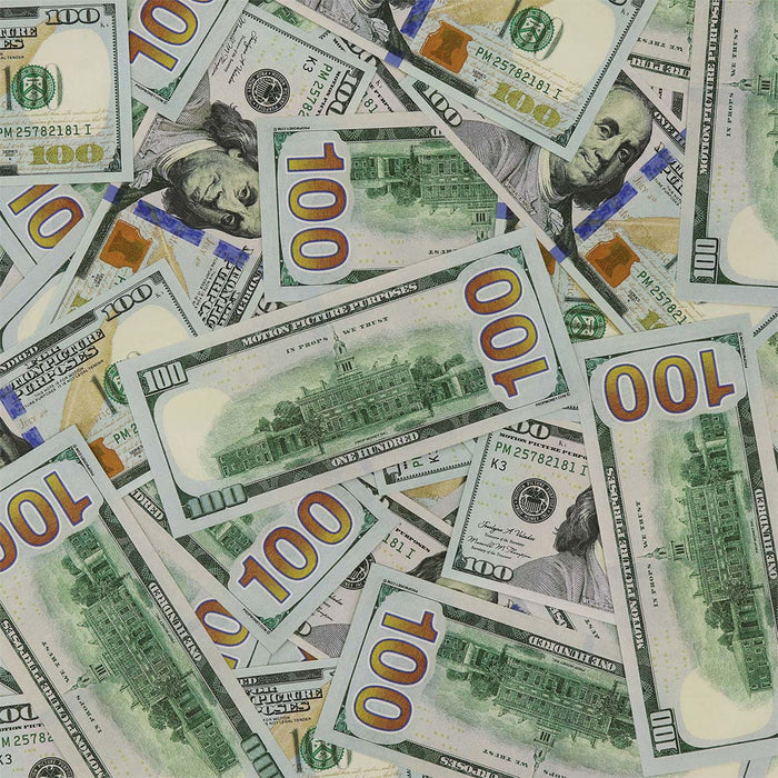 Scattered Full Print New Series $100 prop bills showing fronts and Independence Hall backs