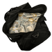 Actual black duffel bag filled with 50 Full Print $100 prop money stacks, shown as one bag from the multi-duffel kit