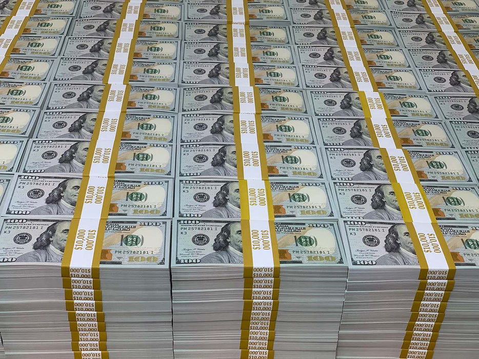 Rows of Full Print $100 prop money stacks wrapped with yellow $10,000 bands