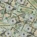 Actual Full Print $20 prop bills scattered together with an Andrew Jackson front-facing bill and motion picture markings